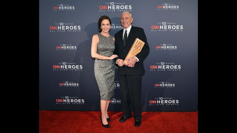 Actress Diane Lane and 2016 CNN Hero Harry Swimmer pose after Swimmer accepted his award. Swimmer turned his <a href="index.php?page=&url=http%3A%2F%2Fwww.cnn.com%2F2016%2F04%2F21%2Fus%2Fcnnheroes-harry-swimmer-mitey-riders-horse%2Findex.html" target="_blank">North Carolina horse farm</a> into a therapeutic haven for children with severe physical and mental disabilities.
