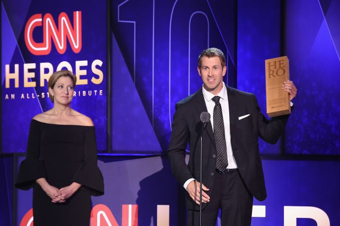 CNN Hero Brad Ludden of First Descents speaks onstage as presenter Edie Falco looks on. Ludden started an<a href="http://www.cnn.com/2016/09/08/health/cnn-hero-brad-ludden-first-descents-cancer/index.html" target="_blank"> outdoor adventure group</a> to give young cancer patients life-affirming  experiences.
