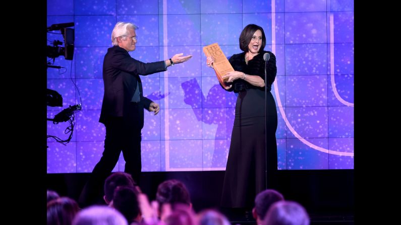 CNN Hero Georgie Smith of<a href="http://www.cnn.com/2016/06/09/us/cnn-heroes-georgie-smith/index.html" target="_blank"> A Sense Of Home</a> accepts her award from presenter Richard Gere. Smith helps former foster kids establish a home all their own after they age out of the Los Angeles foster care system.