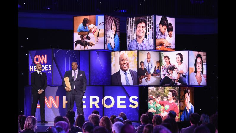 CNN Hero Sheldon Smith of <a href="http://www.cnn.com/2016/03/03/us/cnn-heroes-sheldon-smith-fatherhood-dovetail-project/index.html" target="_blank">Dovetail Project </a>speaks onstage with actor Keegan-Michael Key, left, during Sunday's "CNN Heroes: An All-Star Tribute." Sheldon Smith started a Chicago nonprofit to help young dads become positive role models.