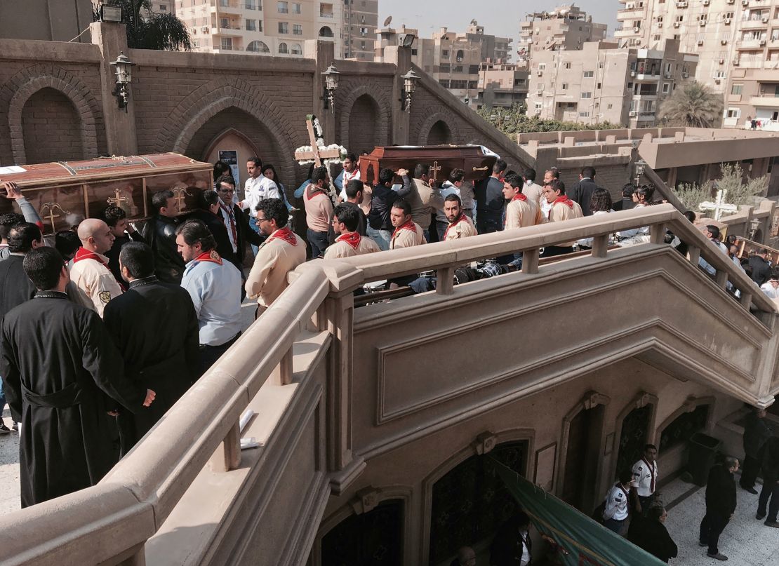 Coffins are carried during a funeral service for victims of Sunday's bombing.