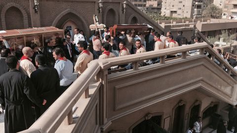 Coffins are carried during a funeral service for victims of Sunday's bombing.