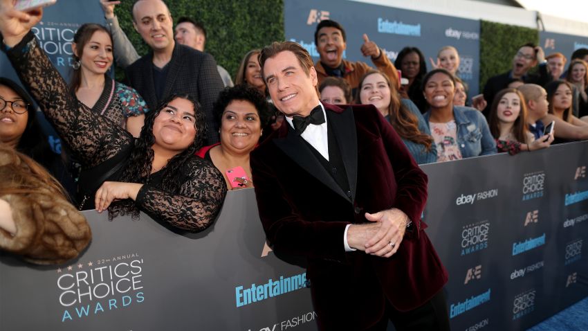 SANTA MONICA, CA - DECEMBER 11:  Actor John Travolta takes a selfie with fans during The 22nd Annual Critics' Choice Awards at Barker Hangar on December 11, 2016 in Santa Monica, California.  (Photo by Christopher Polk/Getty Images for The Critics' Choice Awards )