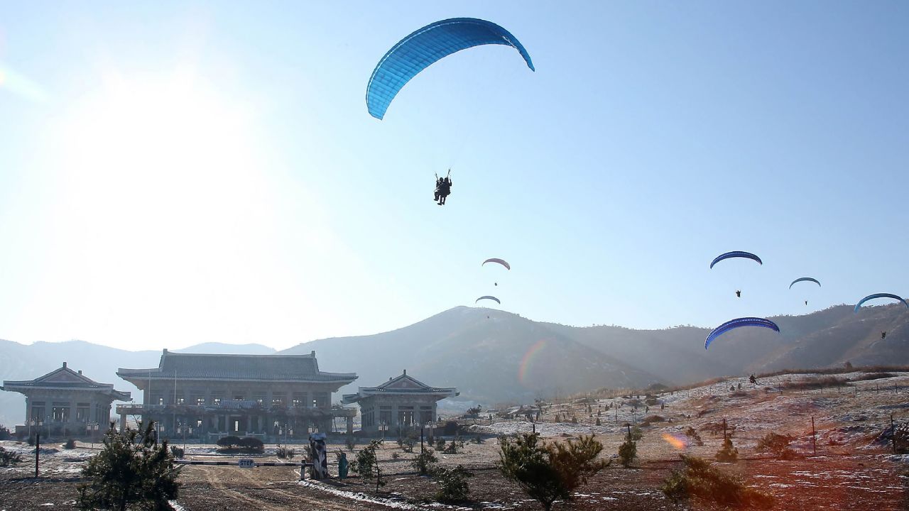 Paratroopers purportedly taking part in a combat drill of the service personnel of the special operation battalion of the Korean People's Army Unit 525.