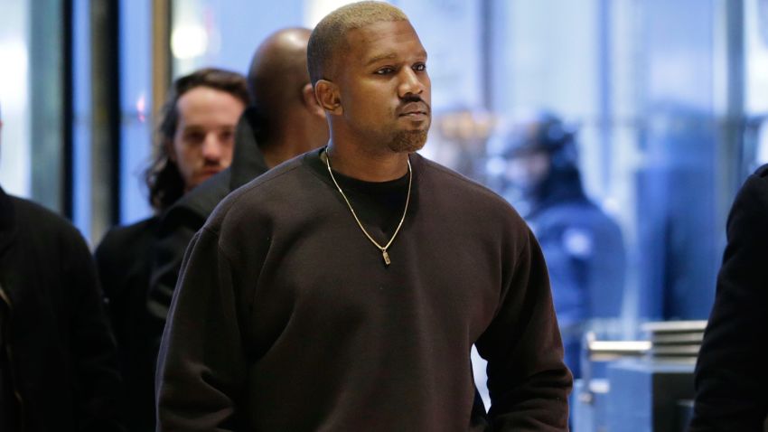 Kanye West enters Trump Tower in New York, Tuesday, Dec. 13, 2016. (AP Photo/Seth Wenig)