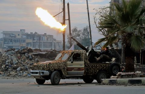 Rebels in southeastern Aleppo target government forces with anti-aircraft weaponry on December 12.
