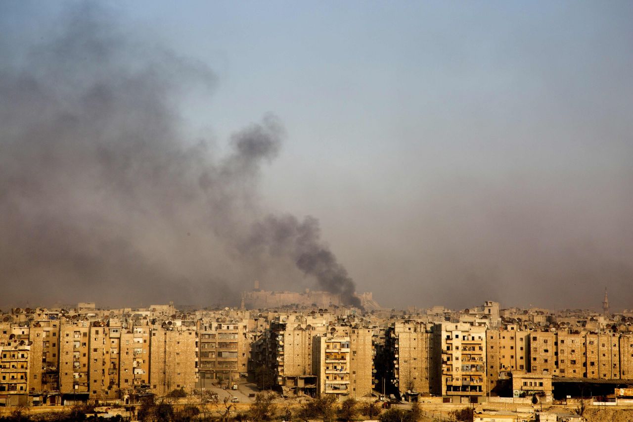 Smoke rises from the Bustan al-Qasr neighborhood on December 12.