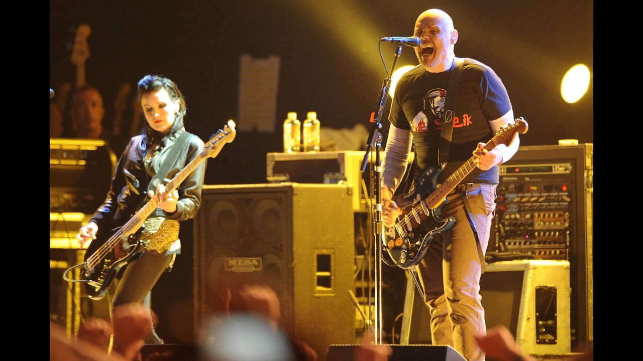 Smashing Pumpkins frontman Billy Corgan, right, formed the band in Chicago with guitarist James Iha in 1988. Their breakthrough second album "Siamese Dream" made the band famous, charting at No. 10 on Billboard's Top 200. Smashing Pumpkins went on to sell 20 million albums and win two Grammy Awards. After breaking up in 2000, the band reformed in 2006. Bassist Nicole Fiorentino, left, joined the band in 2010. 