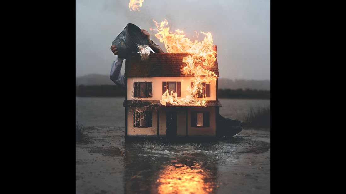 "Boom, you just woke up and what's going on? Or boom, you just woke up and your house is on fire. It's that quick anxiety," Bruno explains. "The most recent image that I shot, I burned a doll house. It's me trying to extinguish the immediate effect of what's going on."