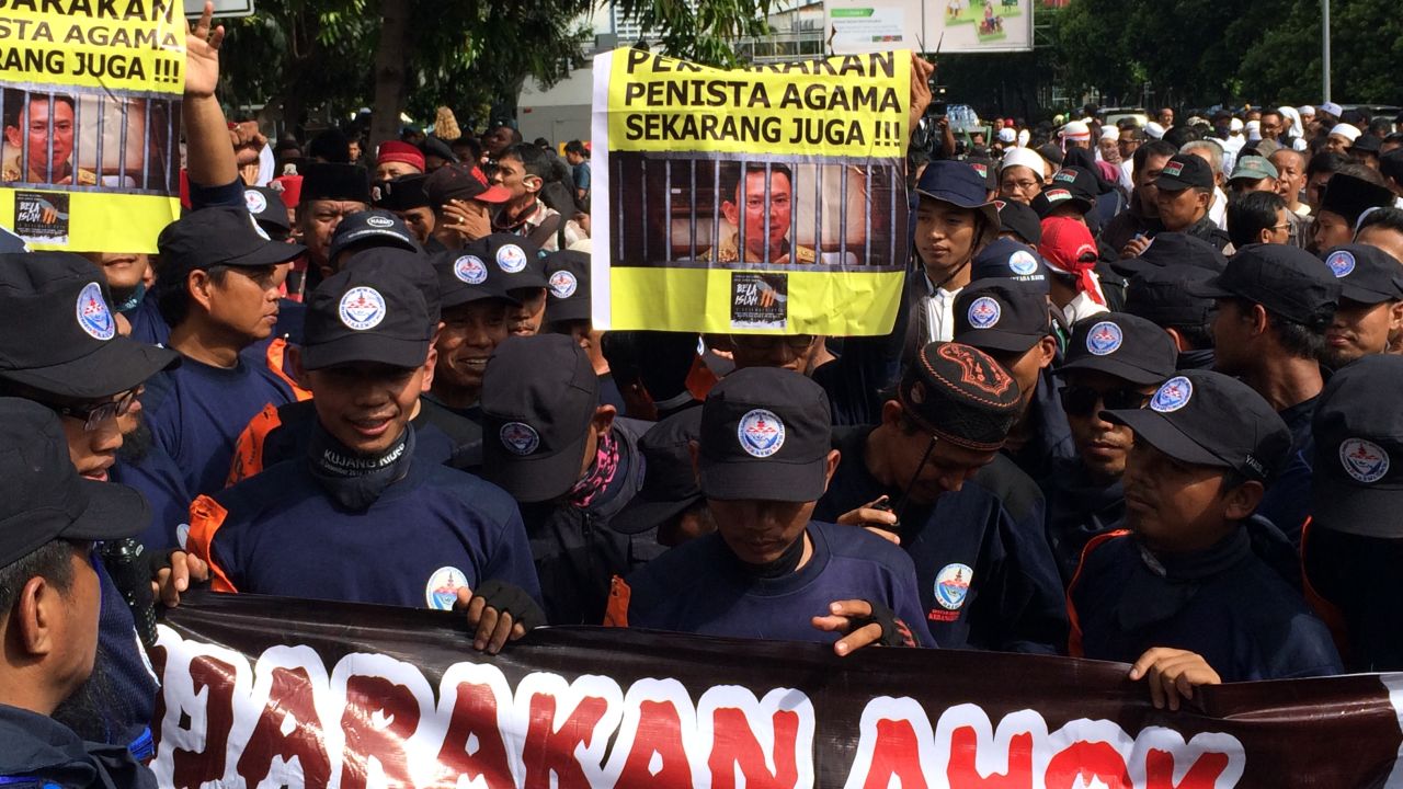 Anti-Ahok protestors gather outside a Central Jakarta courthouse, where the mayor is on trial for blasphemy.