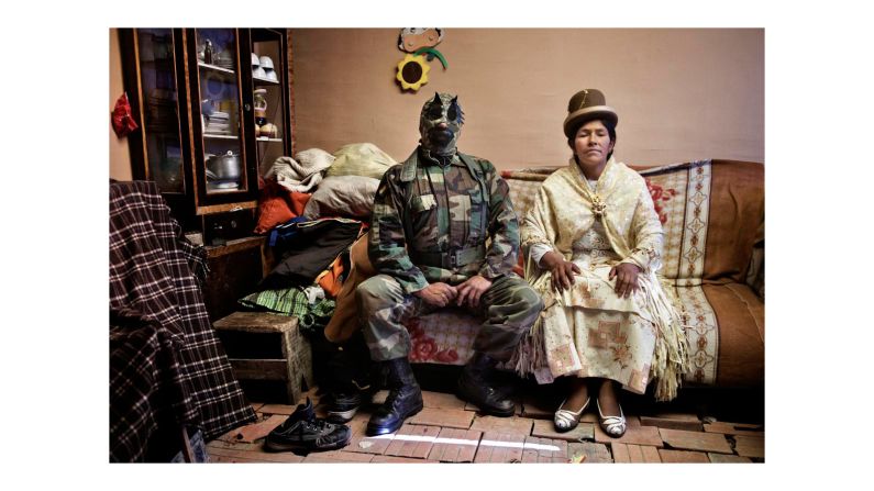 Tamagni photographed the women both in the ring and out of it. Here, Dina La Reina Del Ring sits with her husband, a fellow wrestler. 