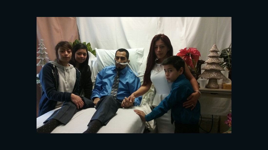Raul and Yvonne Hinojosa pose with three of their children for a picture after the wedding.