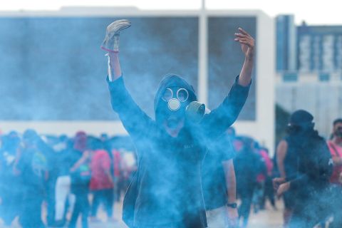 A protester gestures in front of the National Congress in Brasilia on December 13.