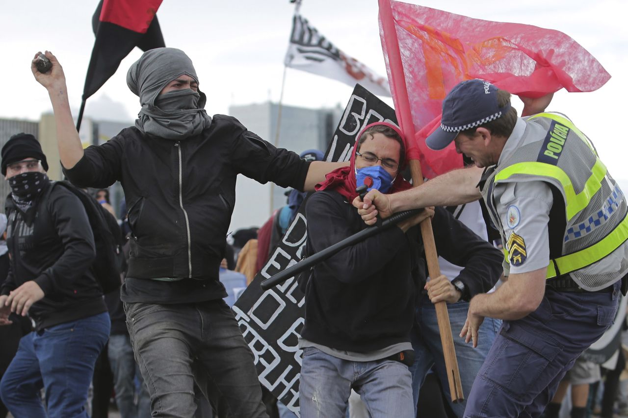  A fight breaks out between demonstrators and police in Brasilia on December 13.