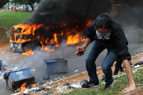 A bus blazes after being set on fire by protesters in Brasilia.