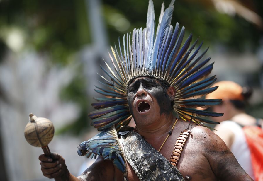 An indigenous man sings during a rally in Rio de Janeiro on December 12.