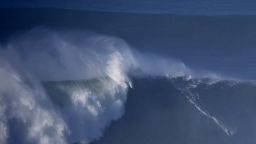 An unidentifyed surfer rides a wave off Praia do Norte in Nazare, central Portugal on December 11, 2014. AFP PHOTO/ FRANCISCO LEONG        (Photo credit should read FRANCISCO LEONG/AFP/Getty Images)