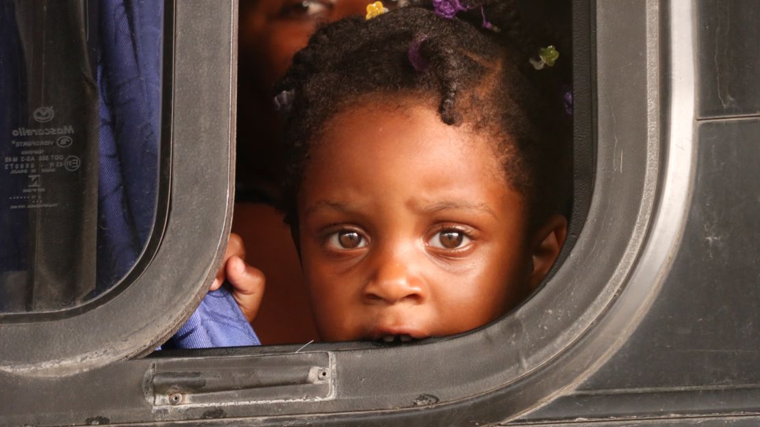 In Paso Canoas, Costa Rica, a child migrant waits on a bus to be taken to a shelter.