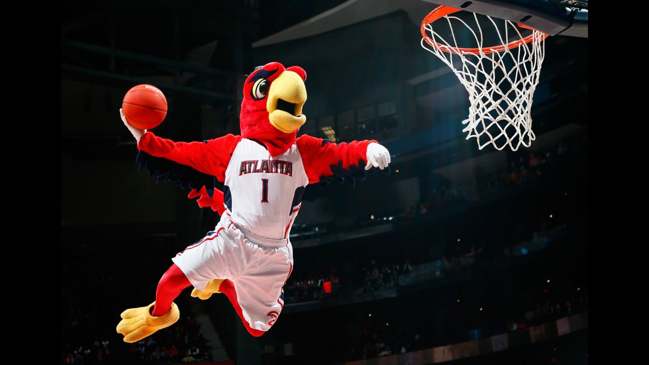 Harry the Hawk shows off his slam dunking skills during a timeout.