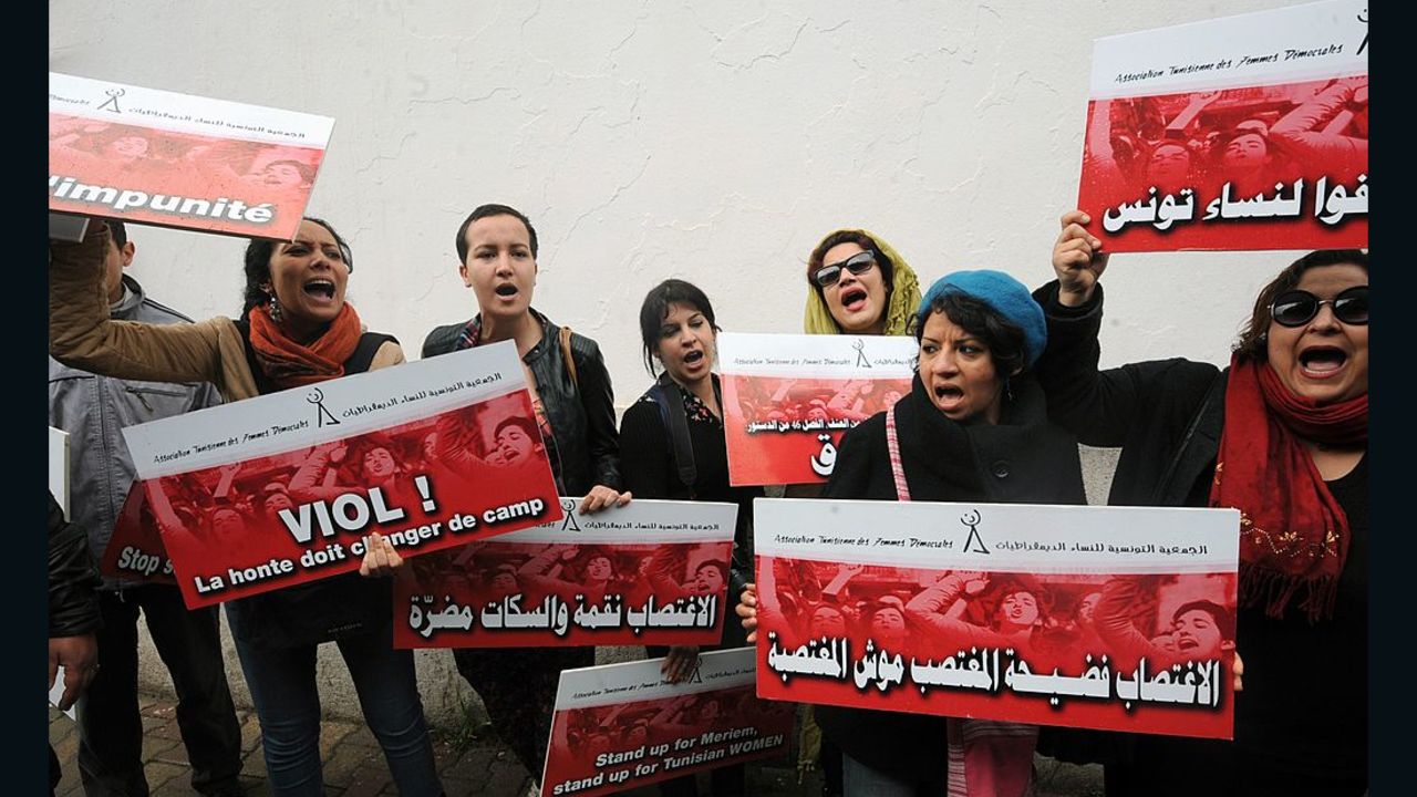Tunisian activists shout slogans during a 2014 protest opposing violence against women.