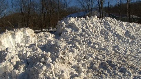 Snow piles up at the scene of the collapse that killed a 13-year-old boy in Greenwich, New York.