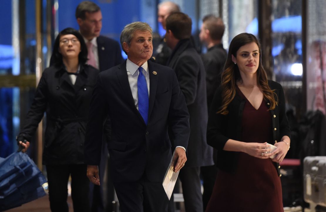 US Rep. Michael McCaul (R-TX), flanked by a presidential transition team aide Madeleine Westerhout, arrives at Trump Tower during another day of  meetings with President-elect Donald Trump November 29, 2016 in New York.