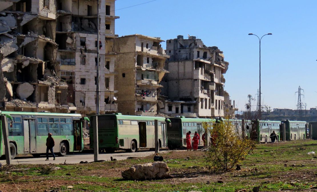 Buses used to evacuate people from rebel-held areas of Aleppo are seen waiting on Thursday.