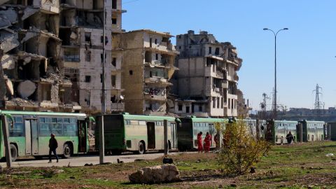 Buses used to evacuate people from rebel-held areas of Aleppo are seen waiting on Thursday.