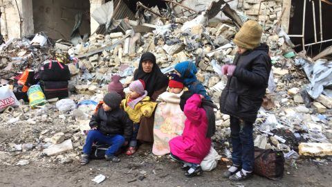 Desperate civilians wait for evacuation from Aleppo on Thursday.