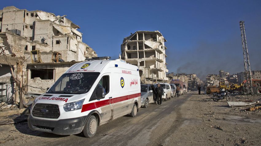 Wounded Syrians and their families gather at the rebel-held al-Amiriyah neighbourhood as they wait to be evacuated to the government-controlled area of Ramoussa on the southern outskirts of the city on December 15, 2016.
Russia, Syrian military sources and rebel officials confirmed that a new agreement had been reached after a first evacuation plan collapsed the day before amid fresh fighting. Syrian state television reported that some 4,000 rebels and their families were to be evacuated.
/ AFP / KARAM AL-MASRI (Photo credit should read KARAM AL-MASRI/AFP/Getty Images)