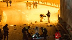 ISTANBUL, TURKEY - DECEMBER 10:  (EDITOR'S NOTE: Image contains graphic content) Forensic policemen and officers attend the scene following a twin suicide bomb attack near to  Besiktas Vodaphone Arena on December 10, 2016 in Istanbul, Turkey. According to reports, at least 13 people were killed by a twin suicide bomb attack near to the Besiktas Vodaphone Arena, which is believed to have been targeting riot police. (Photo by Kurtulus Ari /Getty Images)
