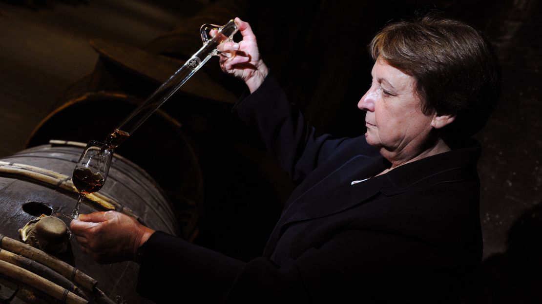 Cellar master Pierrette Trichet, checks the quality of a cognac barrel. 