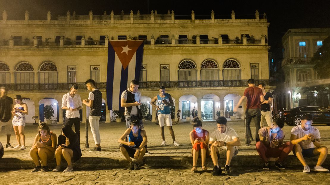 Public Wi-Fi spots, such as this one outside the Santa Isabel Hotel in Havana, have become popular gathering places.