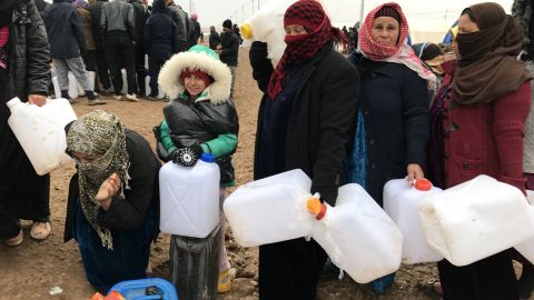 Shelter, food and water are provided, but refugees must wait in line to collect supplies.