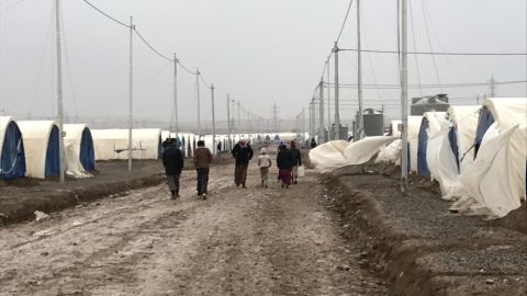 Refugees head to the camp where they live in tents provided by the UN.