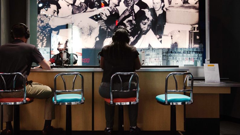 The past is connected to the present at the Center for Civil and Human Rights, where visitors can listen through headphones to increasingly intense taunts and threats endured by protesters during staged sit-ins at "whites only" dining counters in the 1960s. 