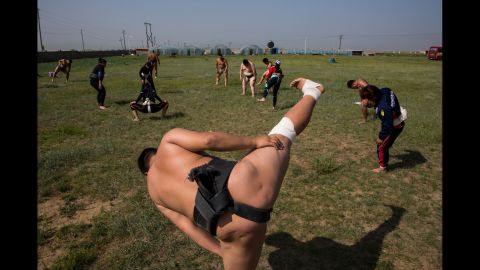 Sumo wrestlers stretch during a training camp on the outskirts of Ulaanbaatar, Mongolia, in July. Photographer Taylor Weidman shadowed young wrestlers before the World Sumo Championships, where they hoped to make a name for themselves and find a future with a sumo stable.
