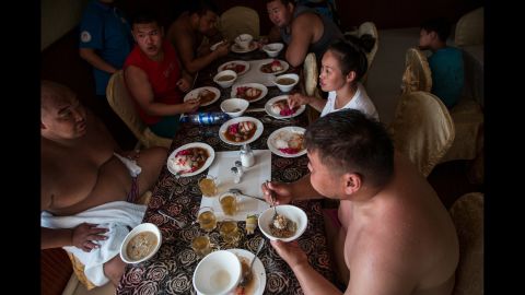 Wrestlers eat lunch together at the training camp. "Wrestlers would eat big meals with lots of mutton and rice," Weidman said. "Traditionally, I think sumo wrestlers are supposed to have two huge meals a day, followed by naps so the calories aren't burned off right away."