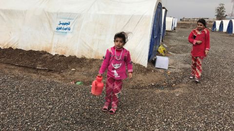 Hala's daughter on her way to fetch fresh water.