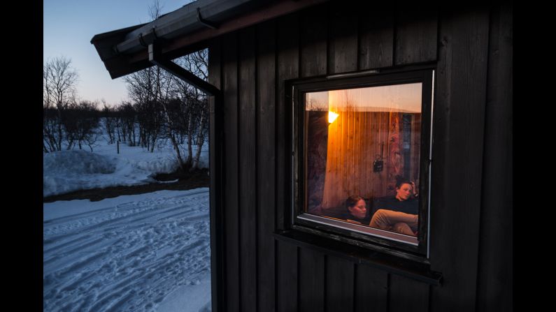 Anne and Christine, two members of the Reindeer Police, rest after a hard day's work.