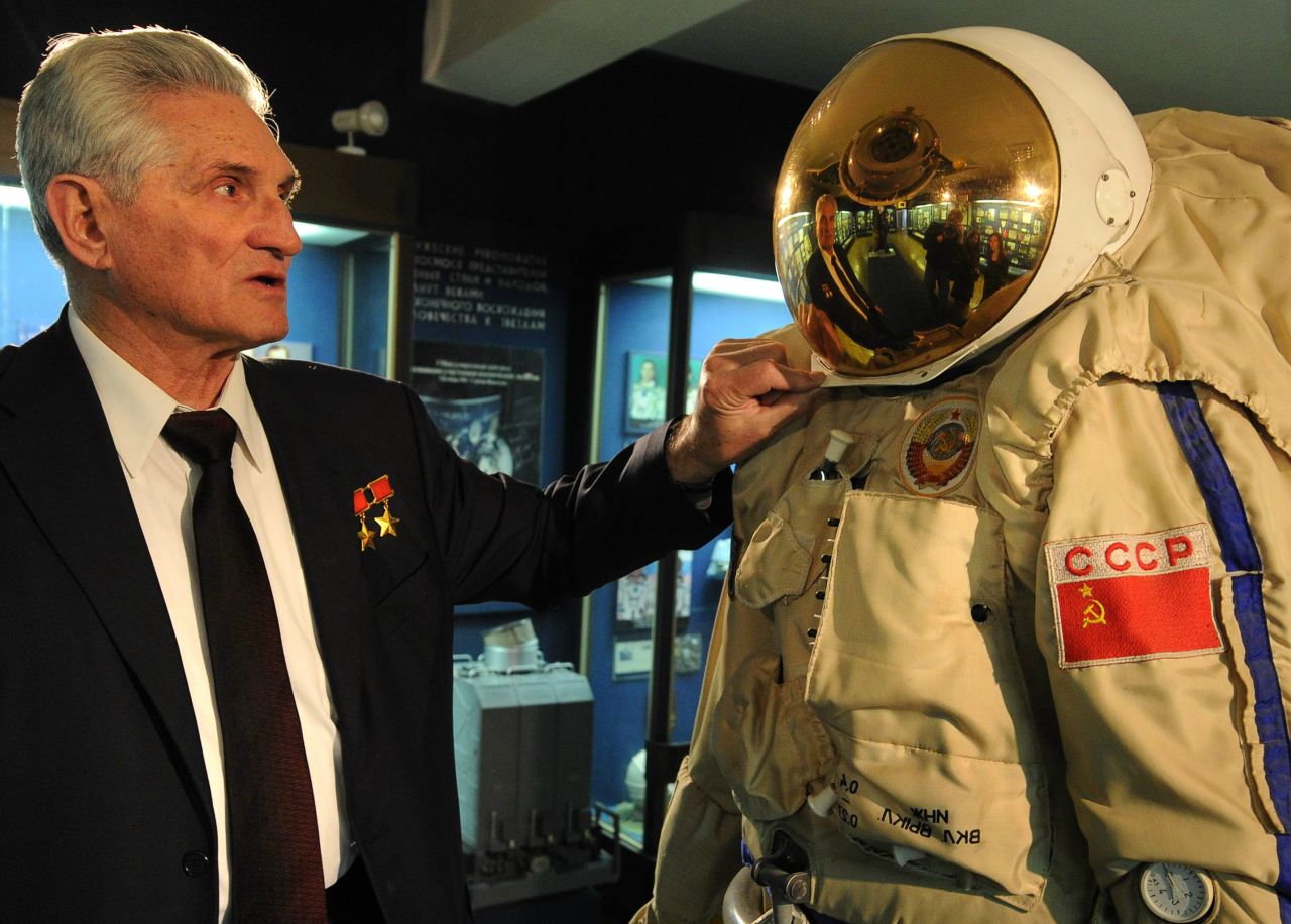 Former Soviet cosmonaut Boris Volynov, a contemporary of Yuri Gagarin, the first human in space, inspects a space suit at Moscow's Museum of Cosmonautics. 