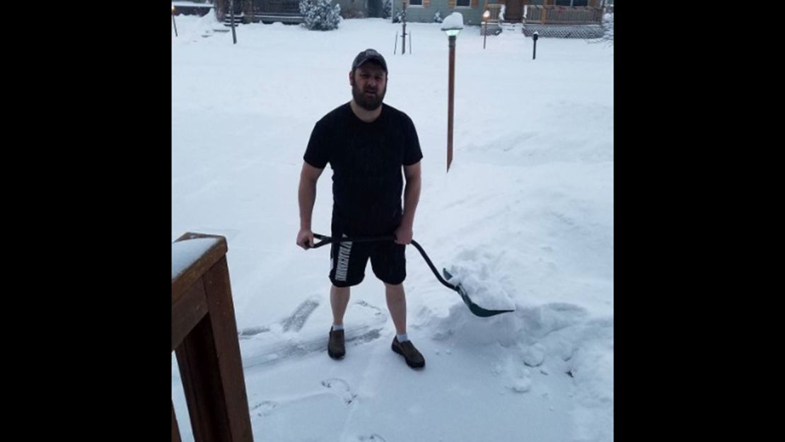 It's not too cold in Montana to keep Steve Clay from shoveling in just shorts and a T-shirt.