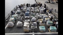Pallets containing more than 26 tons of cocaine worth at least $715 million sit on the flight deck of of 418-foot Coast Guard Cutter Hamilton, Thursday, Dec. 15, 2016, in Fort Lauderdale, Fla. The cocaine was brought ashore Thursday following multiple recent seizures by the U.S. Coast Guard and the Royal Canadian Navy in the eastern Pacific. (AP Photo/Lynne Sladky)