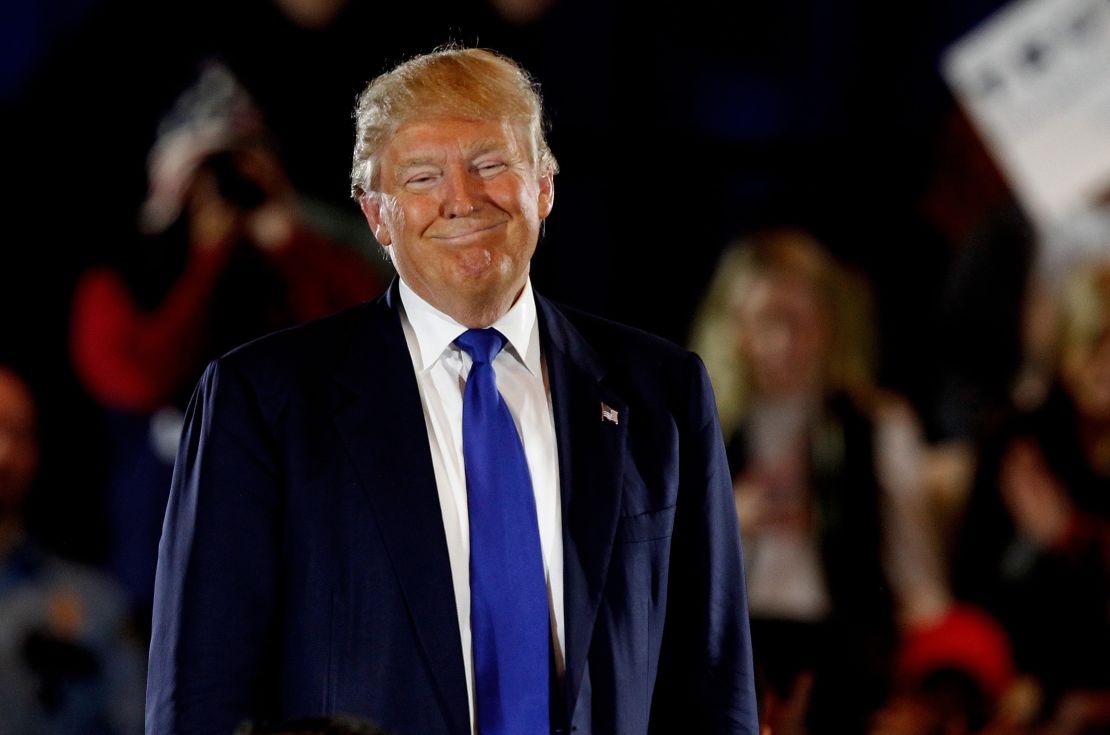  Donald Trump reacts to a question by one of his supporters during a campaign rally in Cincinnati, Ohio. 