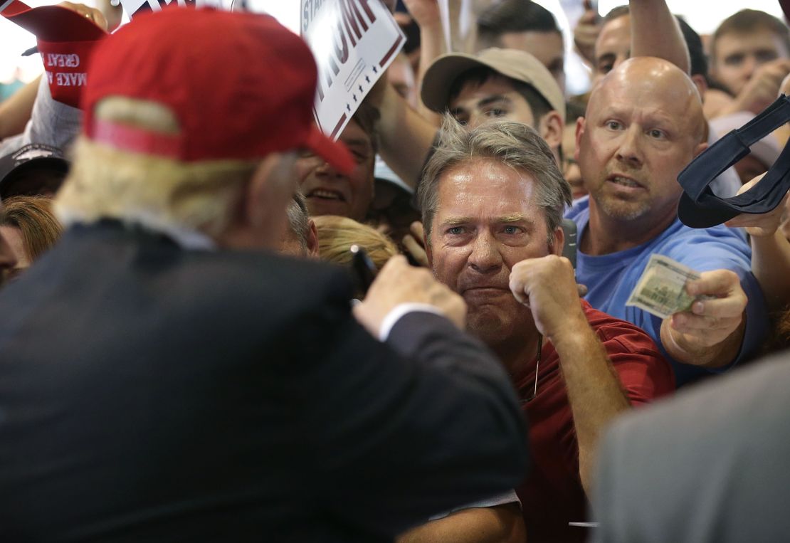 Donald Trump greets supporters during a rally in Harrington, Delaware. He promised voters jobs, and railed against NAFTA.