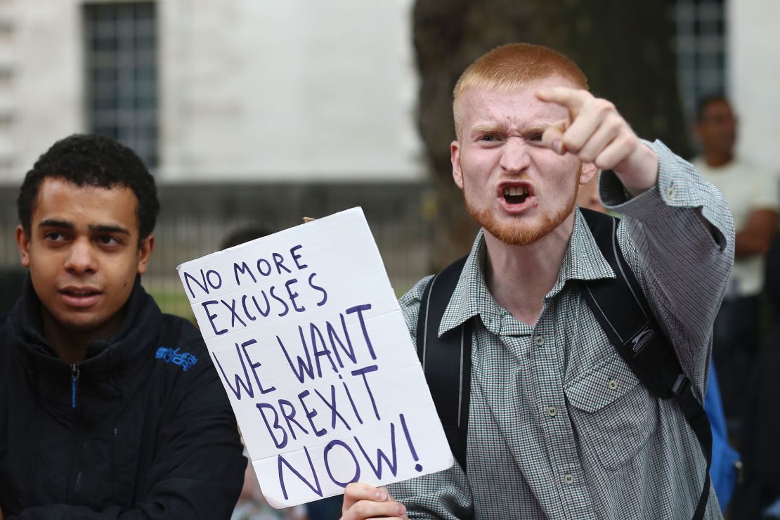 A man carrying a pro-Brexit placard shouts at pro-Europe campaigners in a March for Europe demonstration in London.