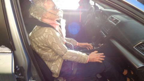 Police photo shows life sized mannequin in detail, seated in front passenger seat and wearing a seat belt 