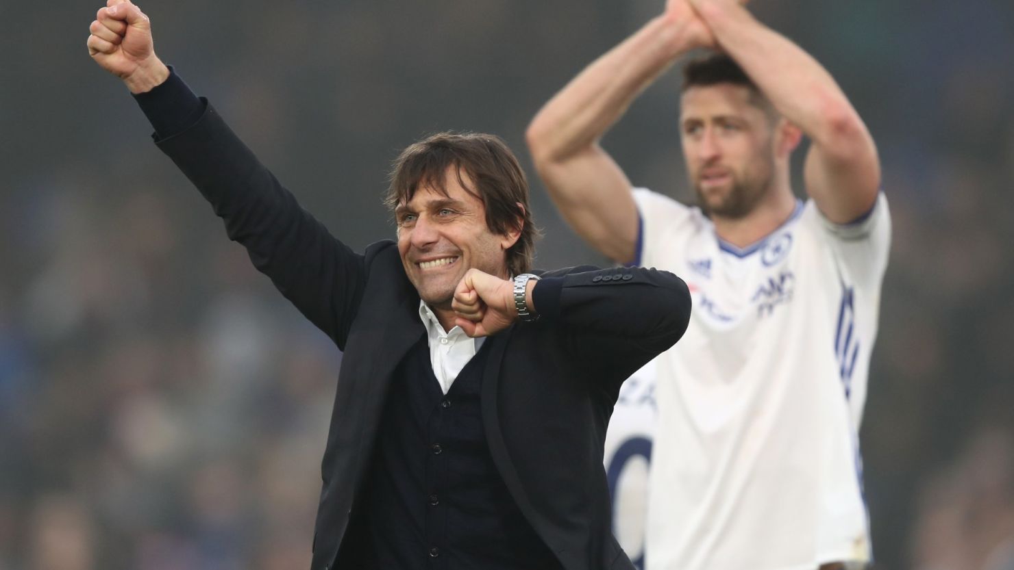 Antonio Conte celebrates his side's club record-equaling 11th straight EPL win after beating Crystal Palace at Selhust Park.