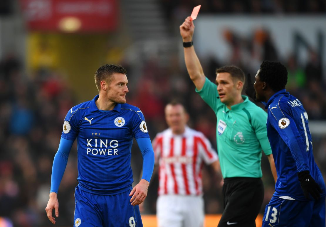 Jamie Vardy of Leicester City is shown a red card by referee Craig Pawson during its match at Stoke City.