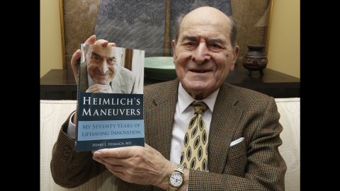 Dr. Henry Heimlich holds his memoir prior to being interviewed at his home in Cincinnati.